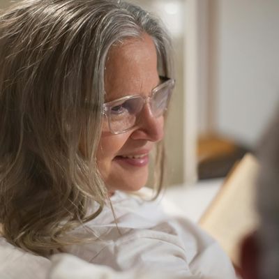 Smiling woman with a calm expression, suggesting a positive experience.